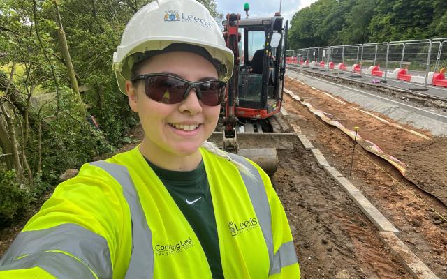 Female Leeds City Council in high vis on site