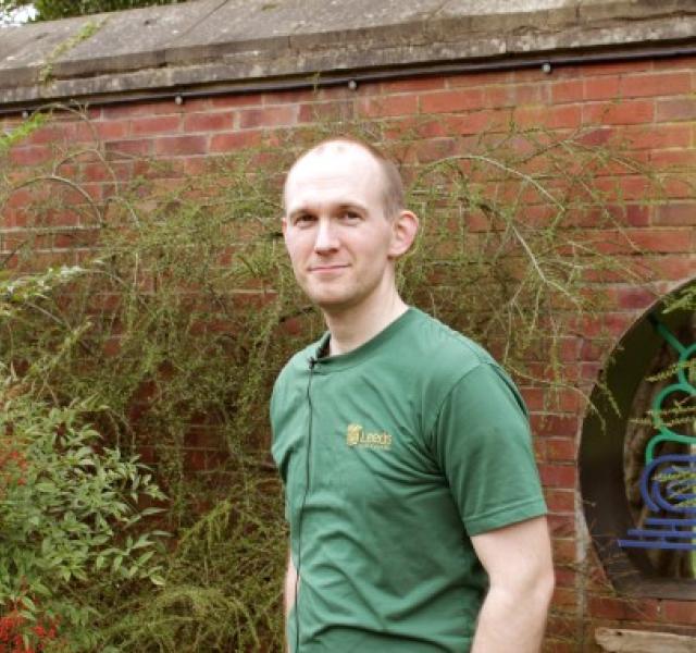 Apprentice Jamie wearing a green Leeds City Council t-shirt